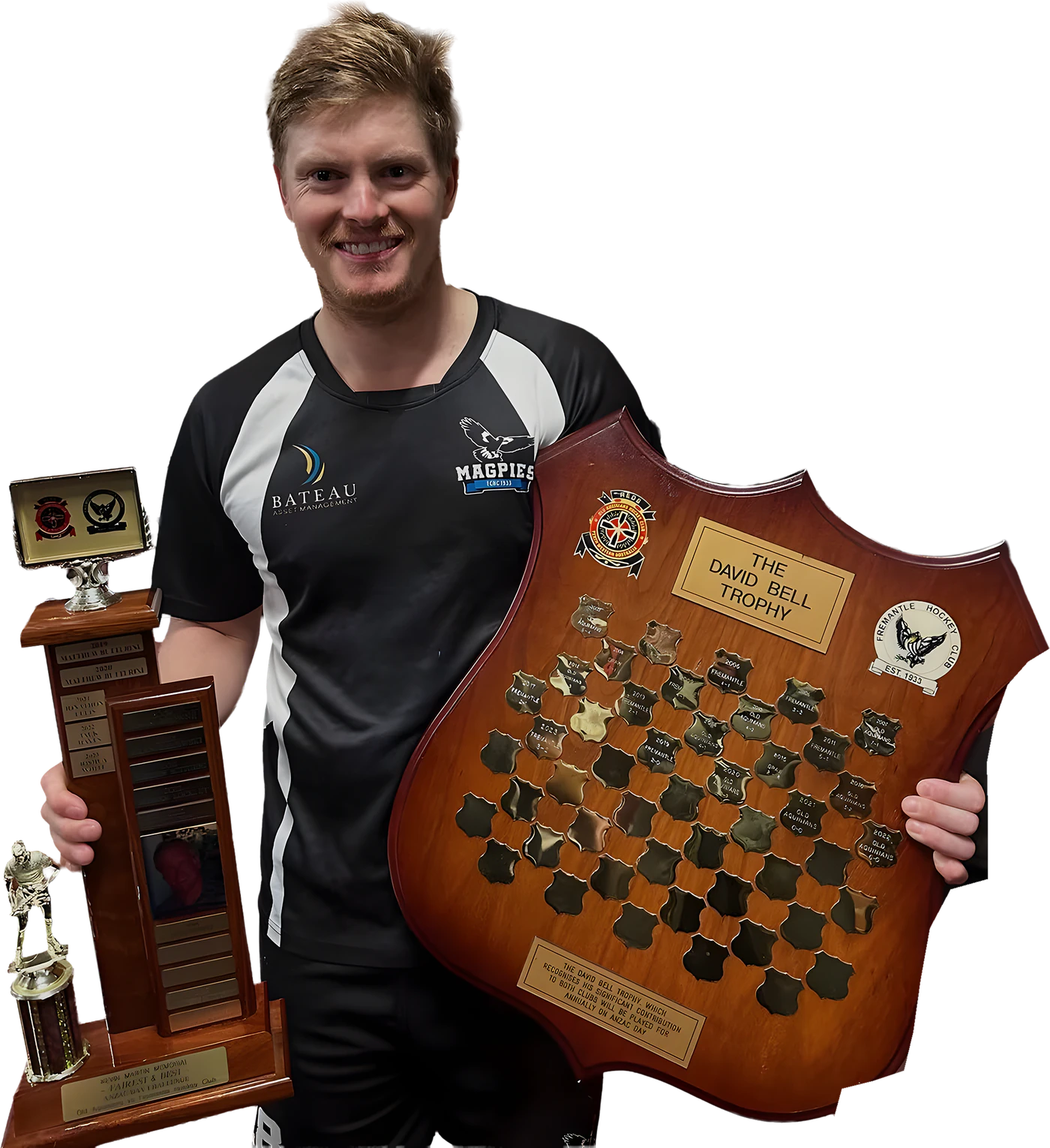 Ben Rennie holding the Kevin Martin Medal trophy and the David Bell Trophy